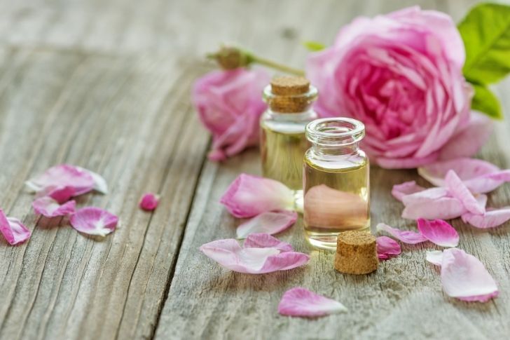 Damask rose essential oil with rose flower.