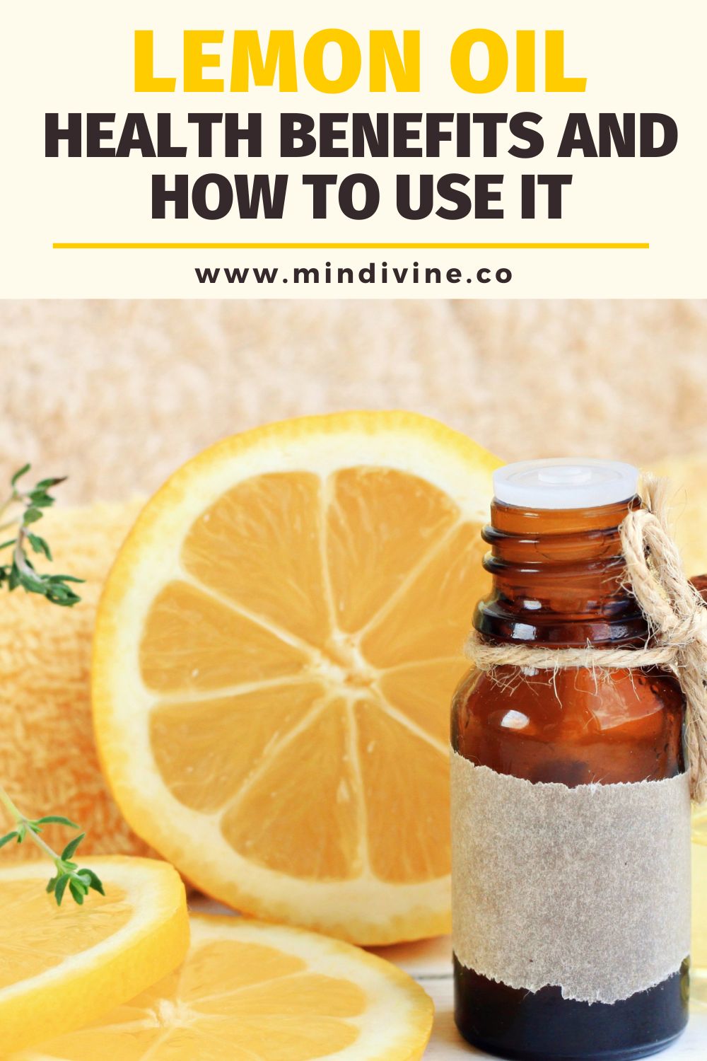 Bottle of lemon essential oil with lemon pieces.