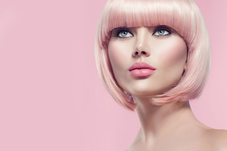 Short Inverted Bob Cut Hairstyle with Pastel Pink Hair Color.
