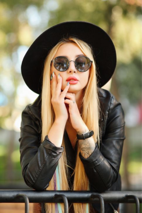 Girl with black fedora hat.