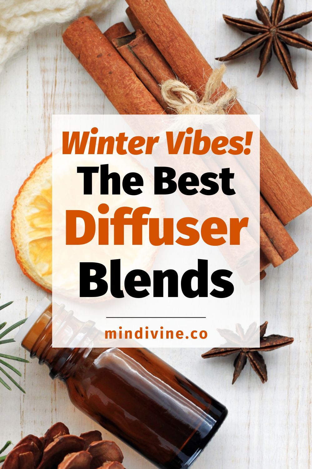Essential oils, orange, cinnamon sticks, anise, fir, cones, wooden blanket, top view.