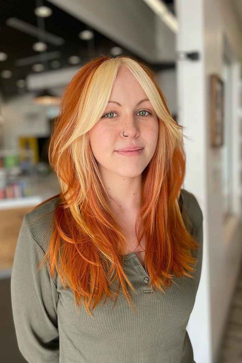 Copper Hair with Face-Framing Highlights and Curtain Bangs