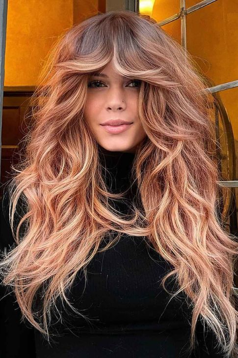 Long Textured Hair with Thick Curtain Bangs